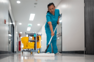 Healthcare Facility Cleaning operative mopping the floor. 3Q Recruitment