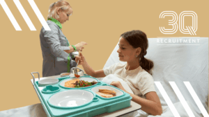 Ward catering assistant delivering meals to patients in a healthcare facility in Tullamore, Midlands