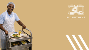 Ward catering assistant delivering meals to patients in a healthcare ward in Dublin 9